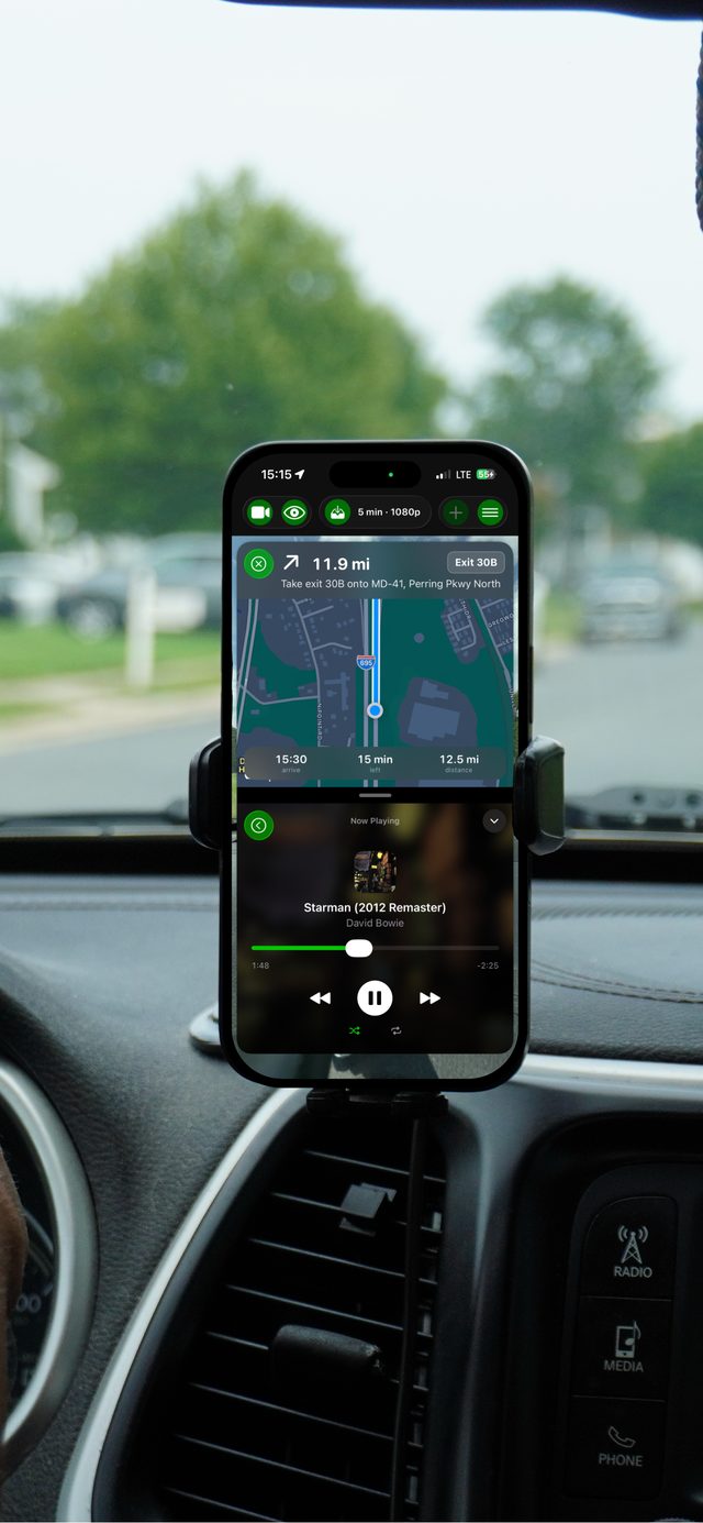 Split view showing turn-by-turn navigation above the music player